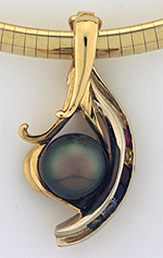 Custom black tahitian pearl pendant with colored sapphires and rubys made by designer goldsmith Fran Cook
